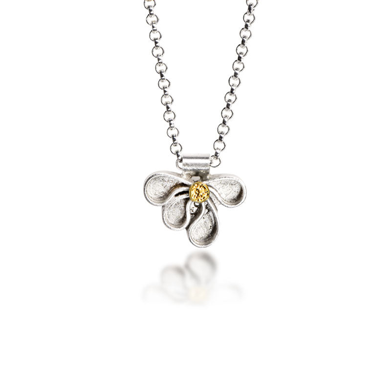 Pendant of fused Argentium droplets forming a cluster with a drop of 18kt gold in the center. Perfect to wear everyday or layer with other favorites necklaces |O'Hara Studios