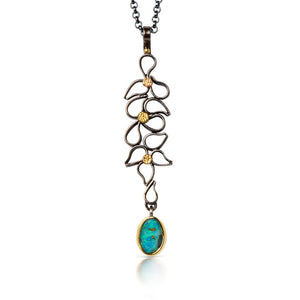 Beautiful pendant of fused argentium forming a waterfall of droplets with 18kt gold drop accents. A boulder opal set in 18kt Gold dangle. 18" sterling chain |OHara Studios